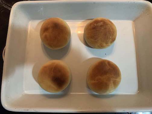 Four slightly burnt rolls
